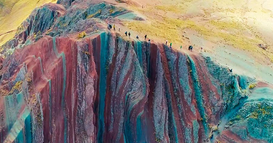 Pallay Poncho rainbow mountain in the middle of the andes