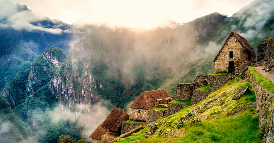 Machu Picchu, inca citadel - buildings inside Machu Picchu at sunrise