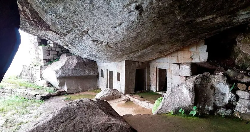 The cave of the sun god at Gran Cavern Machu Picchu, showcasing ancient stone formations and breathtaking mountain views.